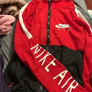 Red Black And White Nike Zip Up Jacket. Nike brand. Size medium.